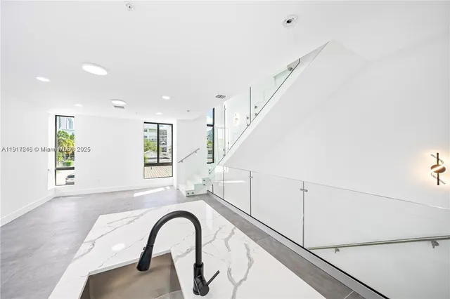a view of an entryway with wooden floor