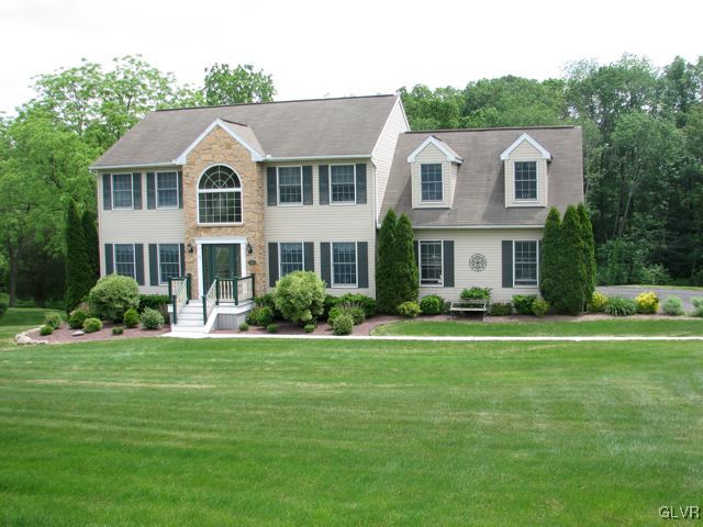 129 West Aluta Mill Road Nazareth, PA 18064 - Photo 2 of 39 a front view of a house with a yard