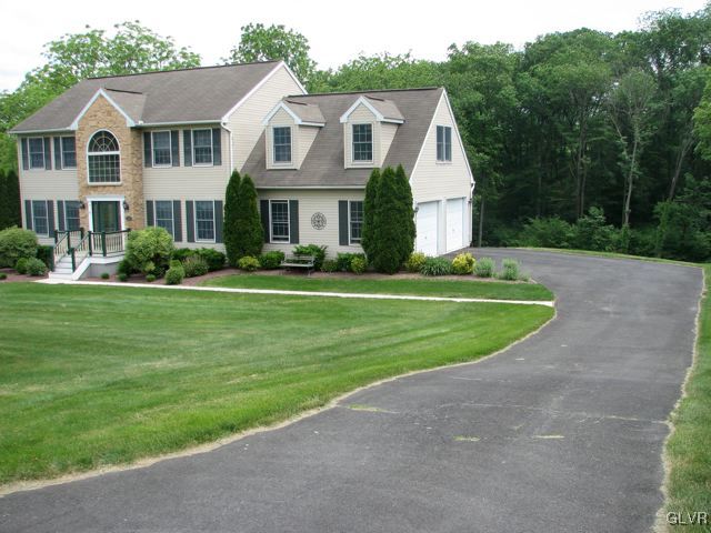 129 West Aluta Mill Road Nazareth, PA 18064 - Photo 3 of 39 a front view of a house with a yard