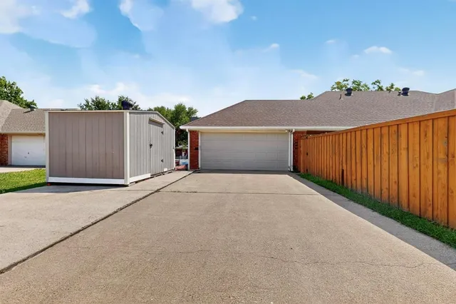 a view of a house with a yard and garage