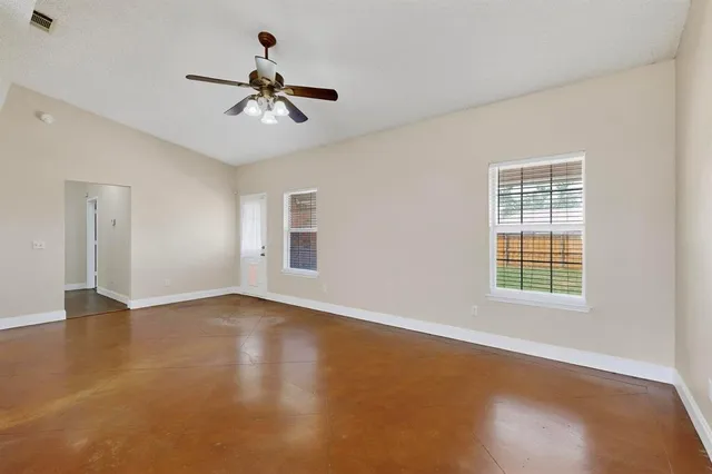 a view of an empty room with a window