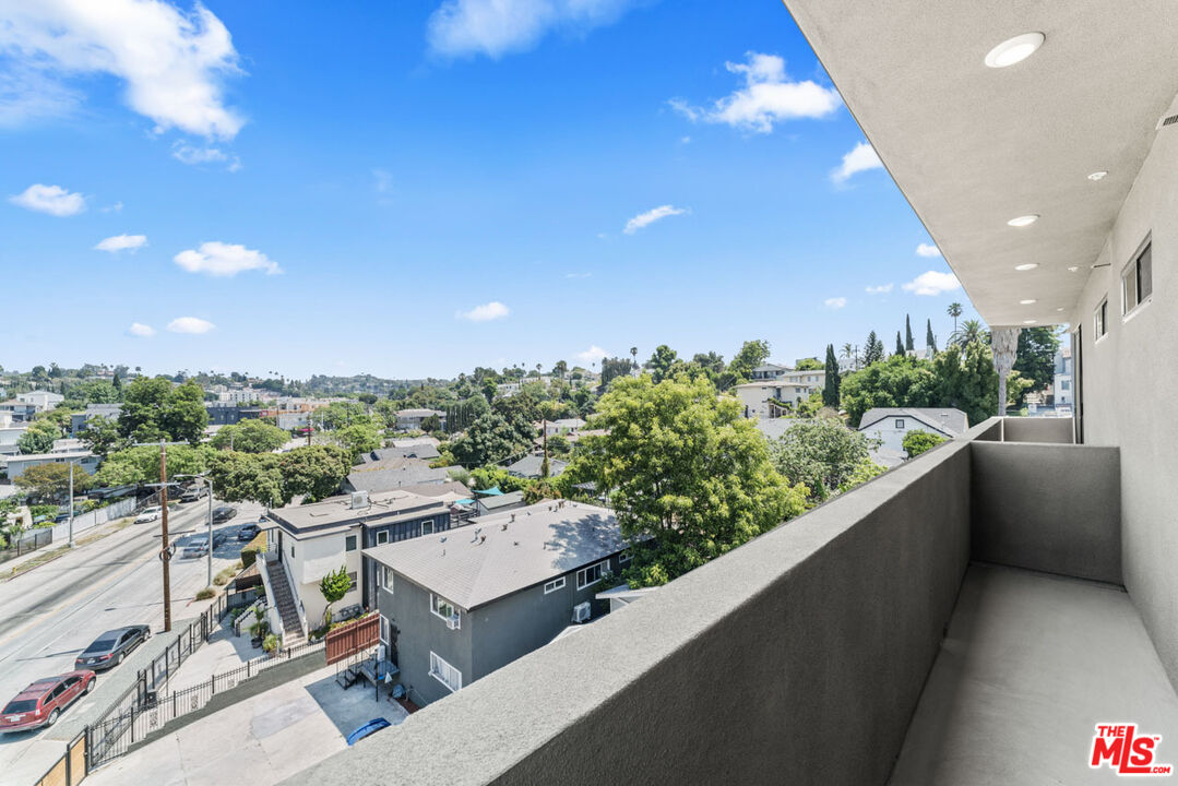 3105 Bellevue Avenue, Unit 204 Los Angeles, CA 90026 - Photo 12 of 20 a view of a balcony with an outdoor space and seating