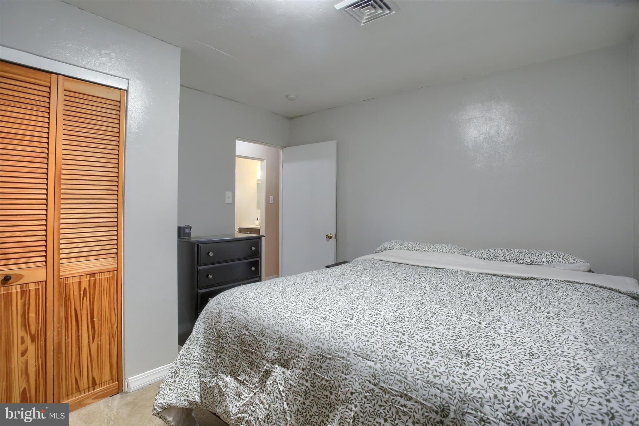 4709 Delbrook Road Mechanicsburg, PA 17050 - Photo 15 of 34 a bedroom with a bed and a window