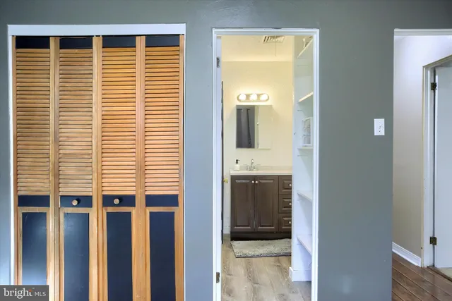 a view of hallway with sink and a large window