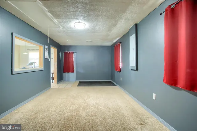 a view of an empty room with windows