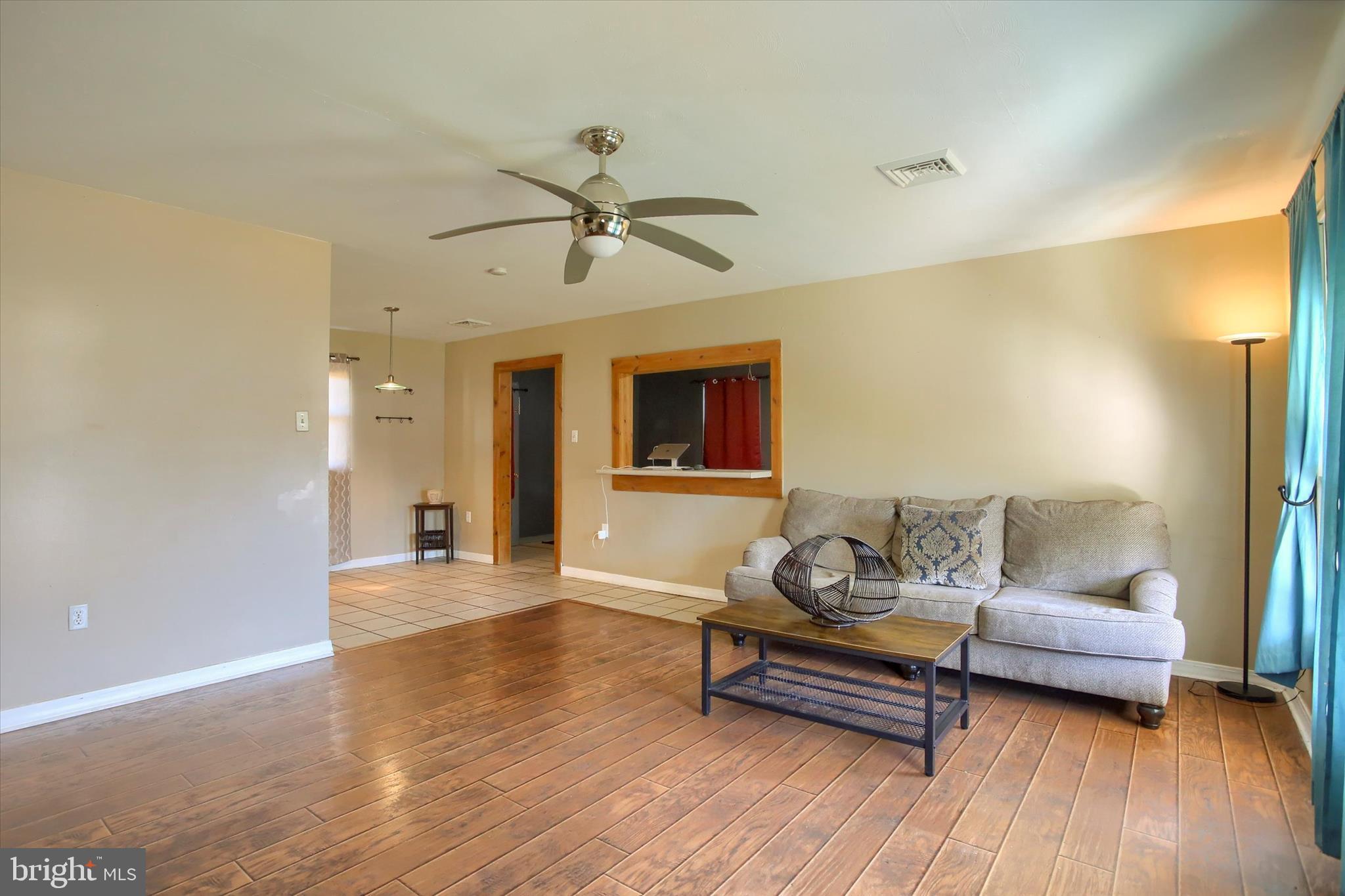 4709 Delbrook Road Mechanicsburg, PA 17050 - Photo 4 of 34 a living room with furniture and a wooden floor