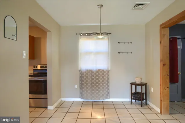 a view of an entryway with a cabinet