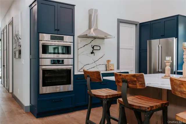 a spacious bathroom with a sink a mirror and a bathtub