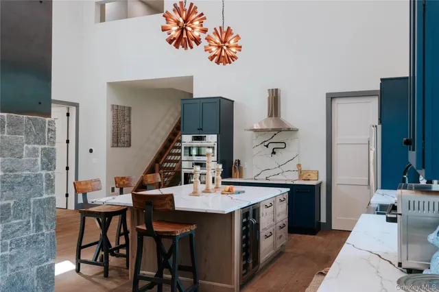 a kitchen with sink a counter and cabinets