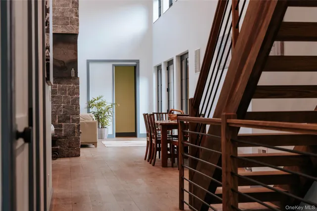 a view of a livingroom with furniture and staircase