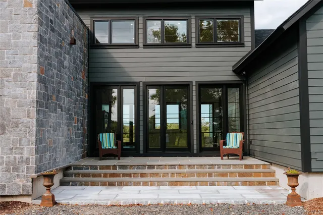 a view of brick house with a large windows
