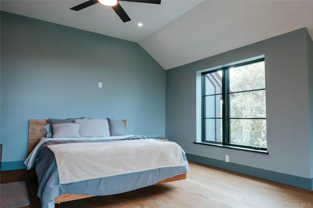 a bedroom with a bed and window