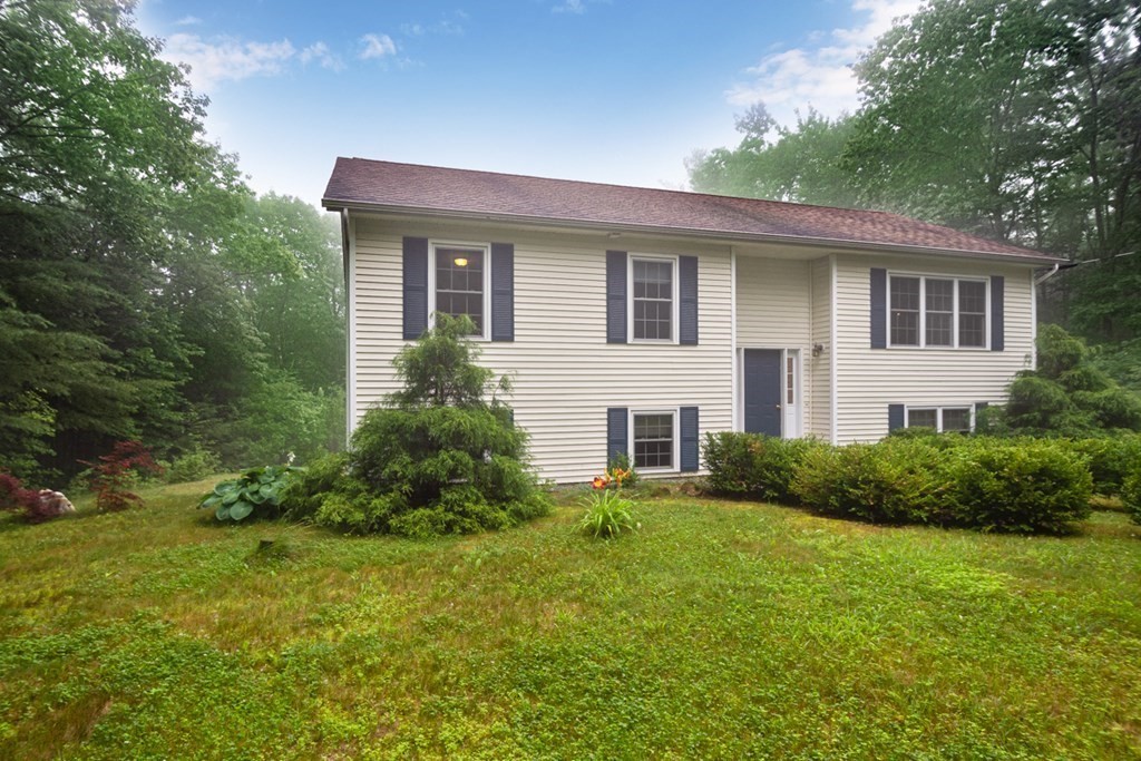 71 Rindge State Road Ashburnham, MA 01430 - Photo 5 of 26 a front view of house with yard and green space