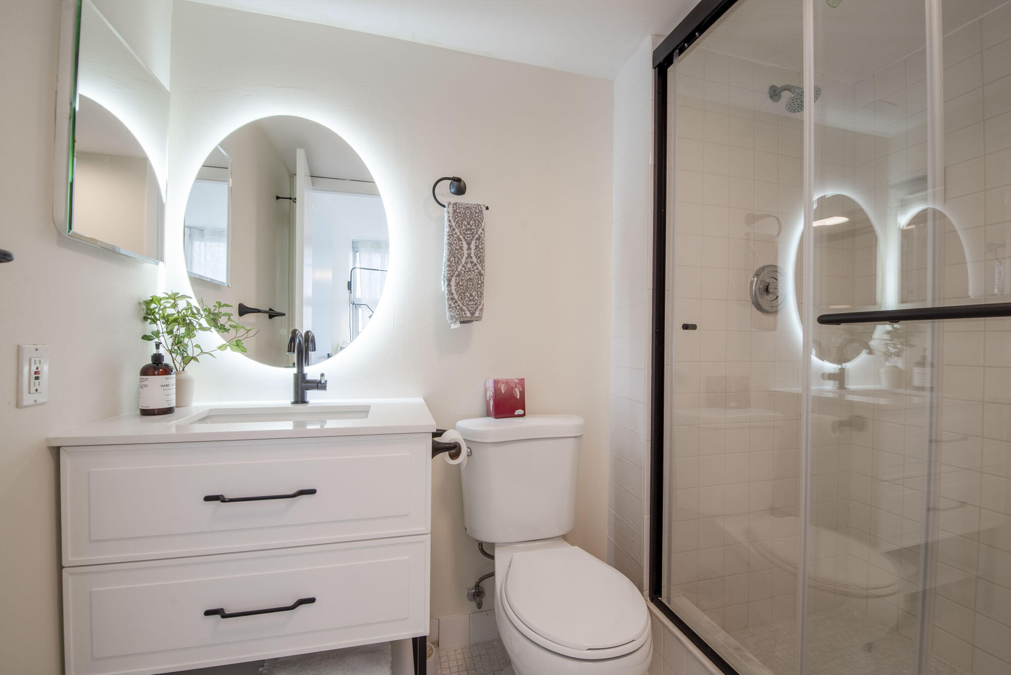 525 North Ocean Boulevard, Unit 1215 Pompano Beach, FL 33062 - Photo 15 of 16 a bathroom with a sink a toilet and shower