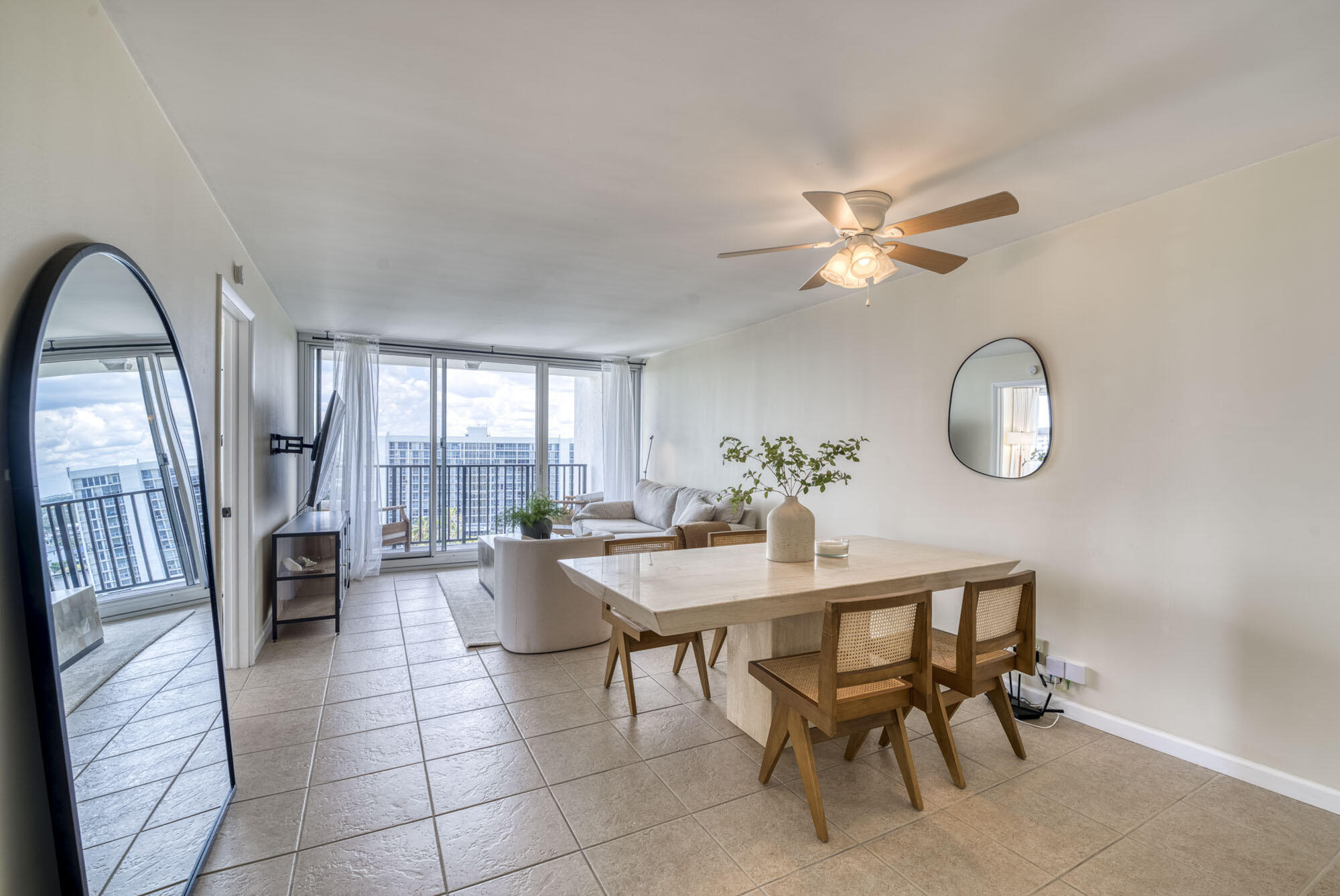 525 North Ocean Boulevard, Unit 1215 Pompano Beach, FL 33062 - Photo 2 of 16 a view of a livingroom with furniture and a ceiling fan