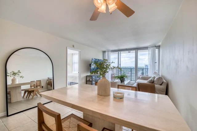 a view of a dining room with furniture window and outside view