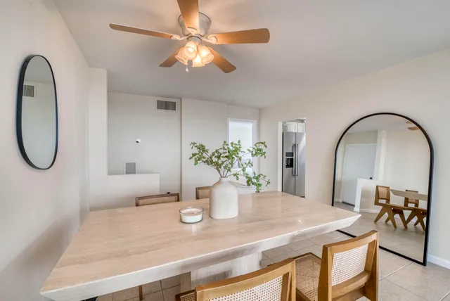 a dining room with table & chairs