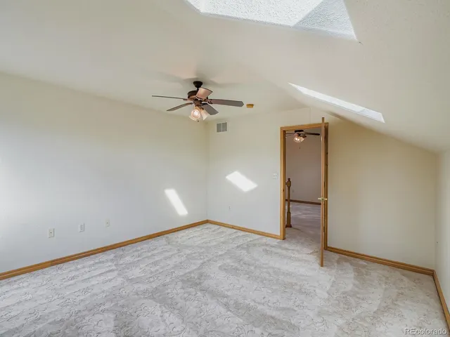 wooden floor in a hall with a window