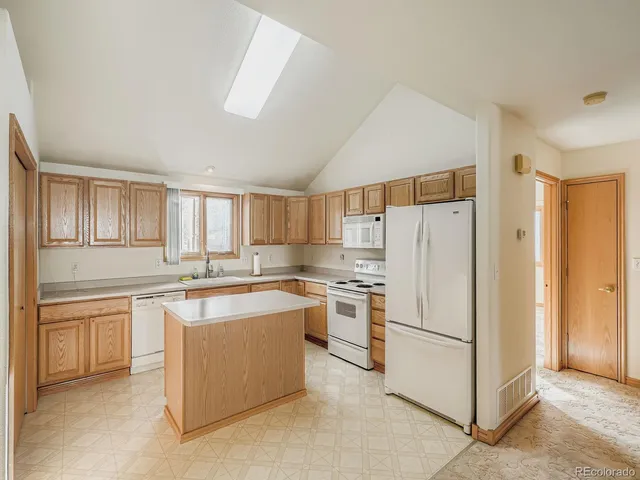 a kitchen with a sink counter top space and cabinets
