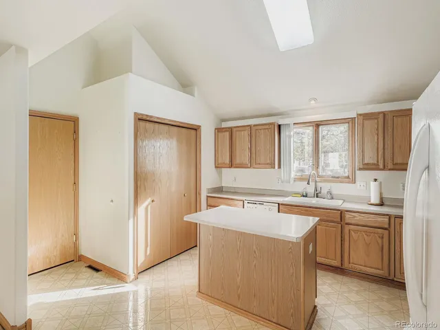 a view of a kitchen with a sink
