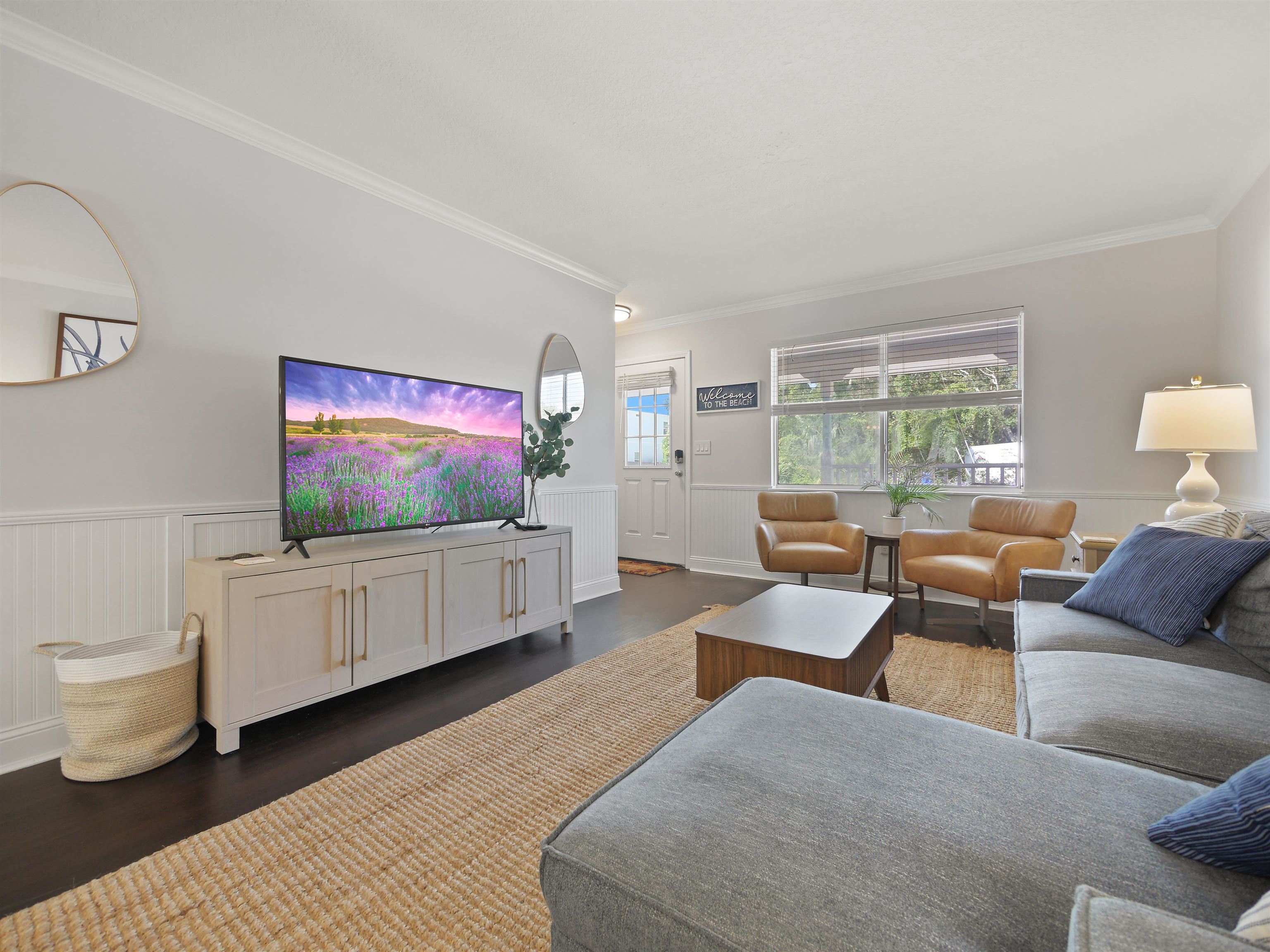 6448 Madison Street St. Augustine, FL 32080 - Photo 8 of 36 a living room with furniture and a flat screen tv