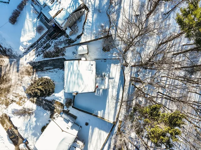 an aerial view of residential building and ocean