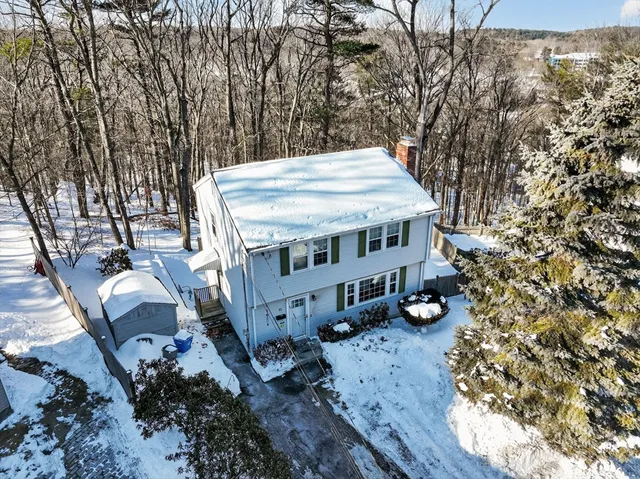a view of a house with roof deck front of house