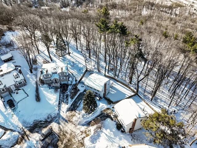 an aerial view of residential house with parking space
