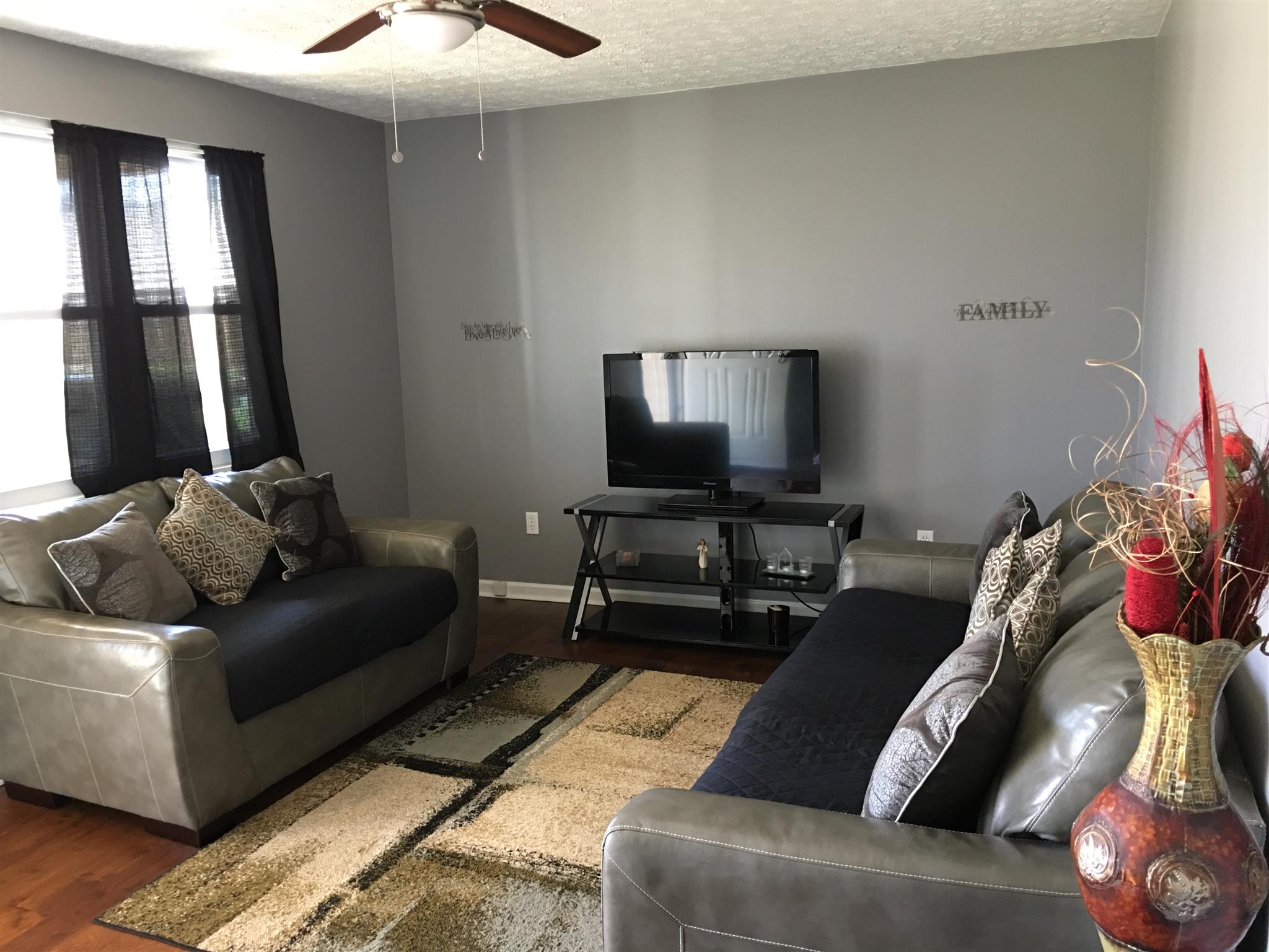 50 Benson Road Manchester, TN 37355 - Photo 3 of 14 The living room is cozy but yet has room for both the sofa and loveseat