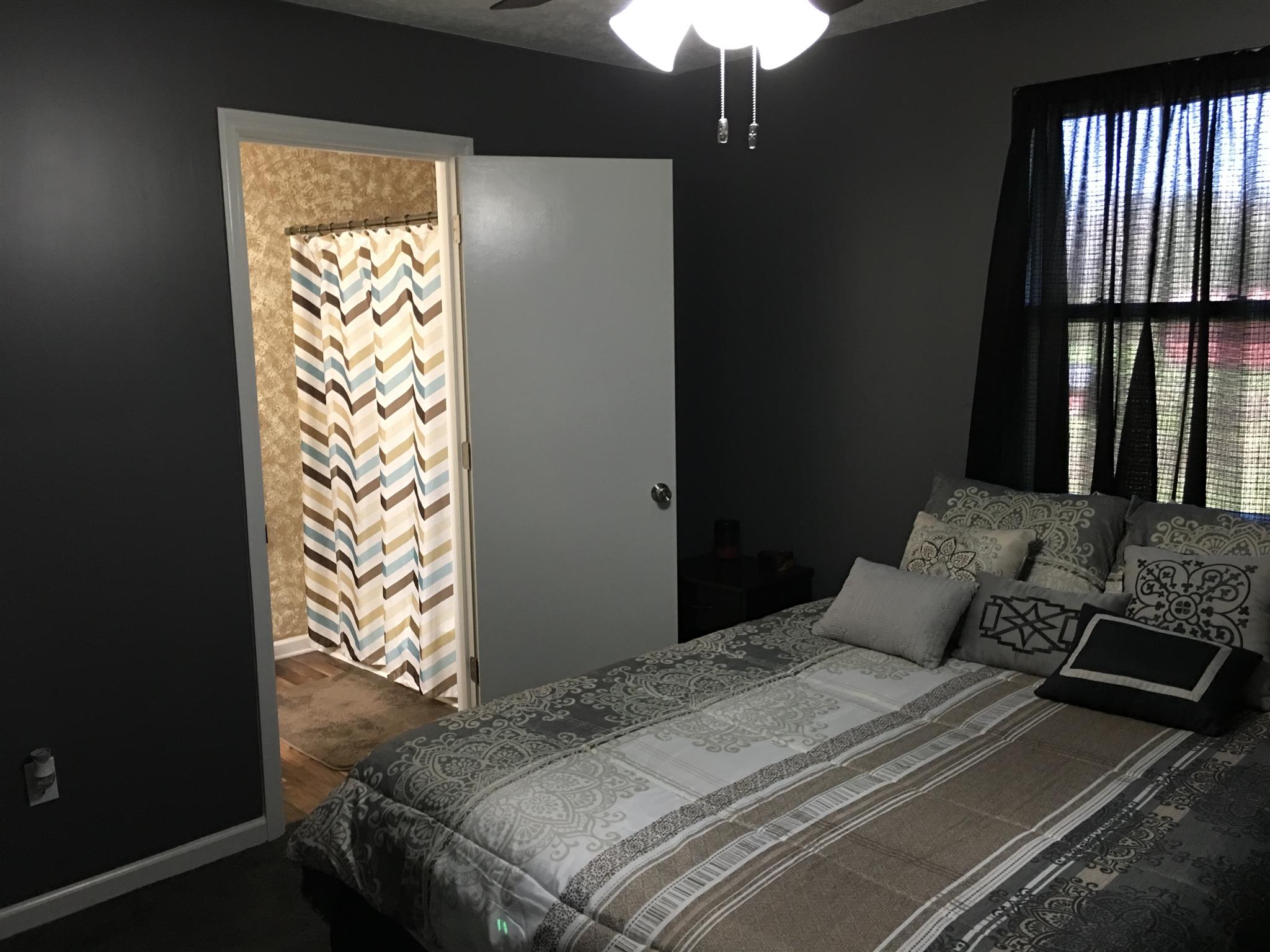 50 Benson Road Manchester, TN 37355 - Photo 7 of 14 The master bedroom has a calming atmosphere and opens directly into the bath.
