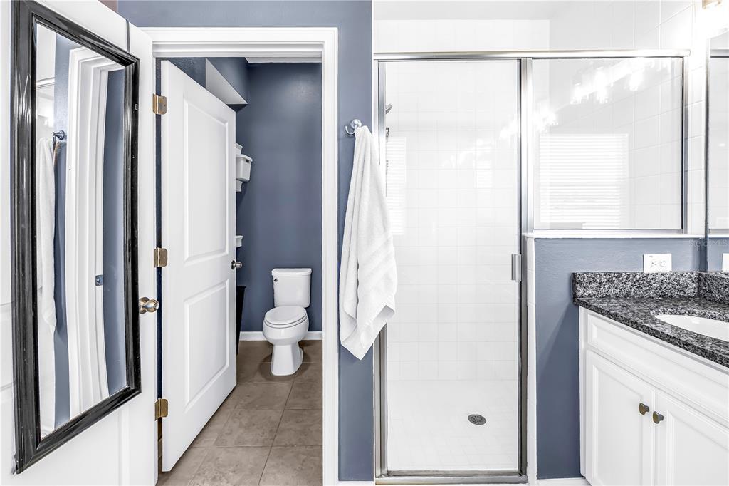 13229 Orca Sound Drive Riverview, FL 33579 - Photo 16 of 37 a bathroom with a granite countertop sink toilet and shower