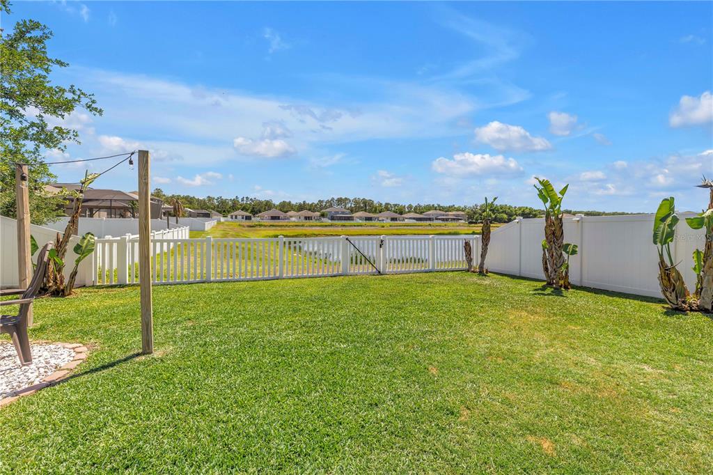 13229 Orca Sound Drive Riverview, FL 33579 - Photo 26 of 37 a view of a garden and basketball court