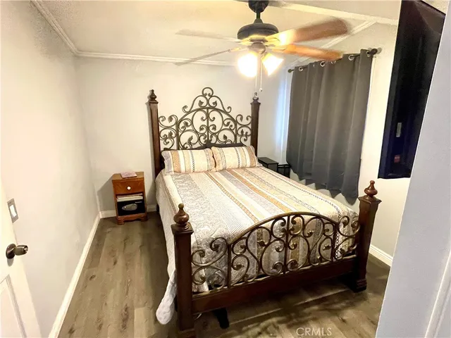a bedroom with a bed and a mirror