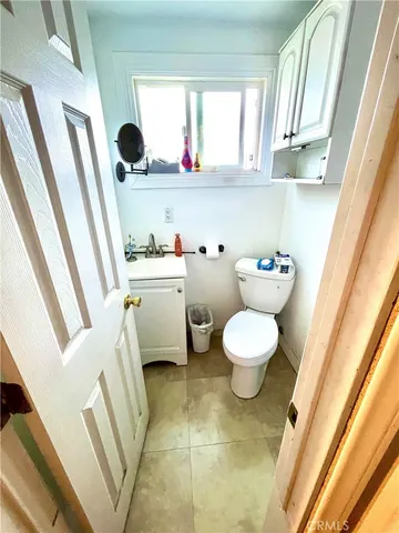a bathroom with a toilet and a sink