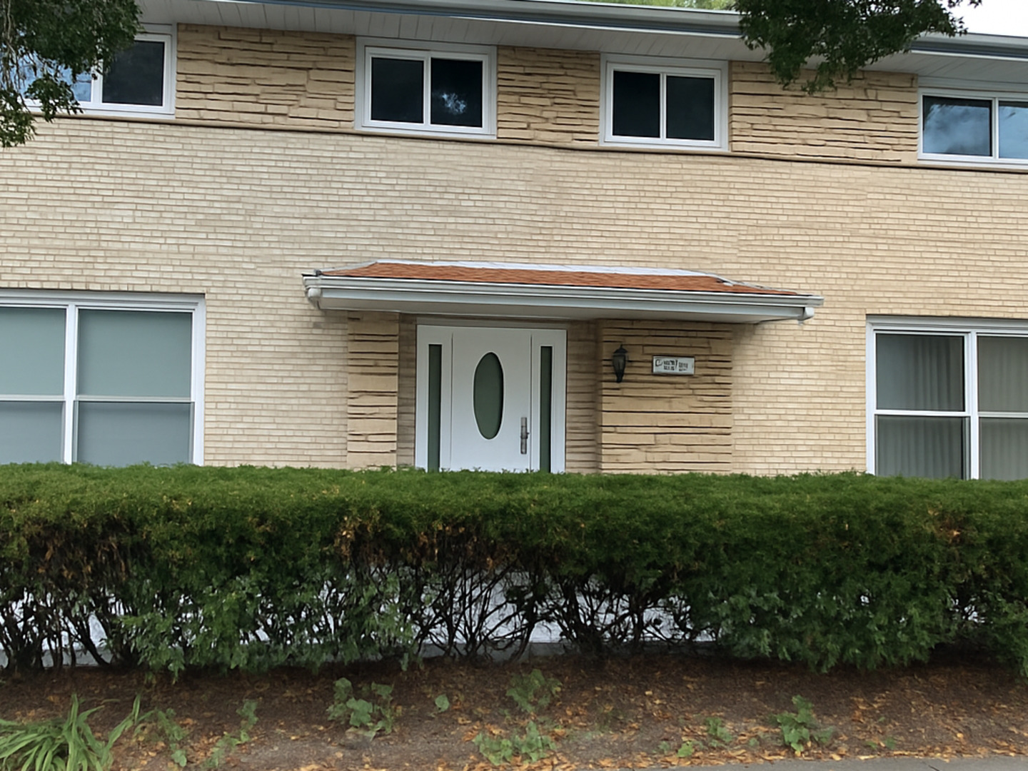 401 Dewey Avenue Evanston, IL 60202 - Photo 1 of 20 a front view of a house with a garden