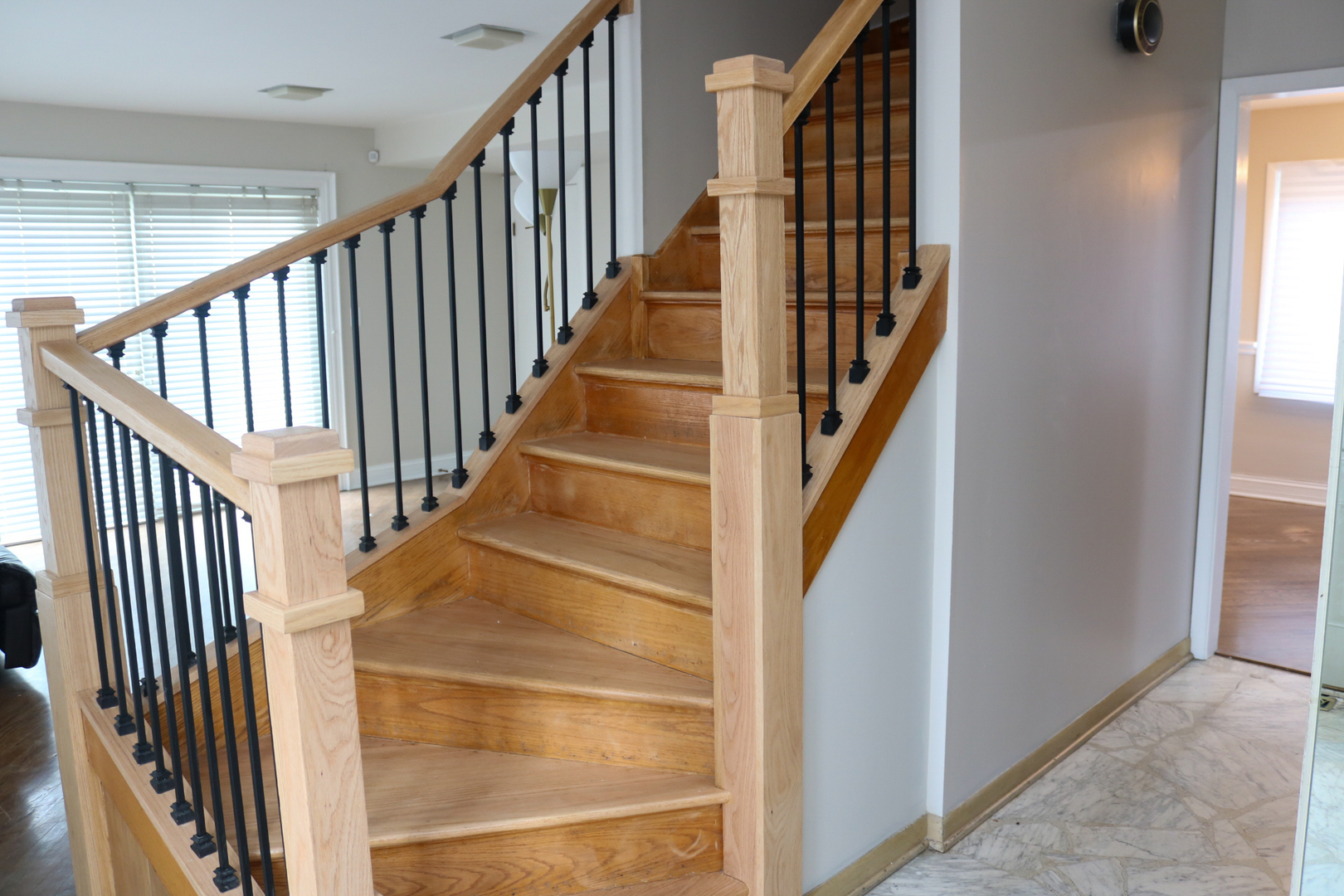 401 Dewey Avenue Evanston, IL 60202 - Photo 9 of 20 a view of staircase with wooden floor and white walls