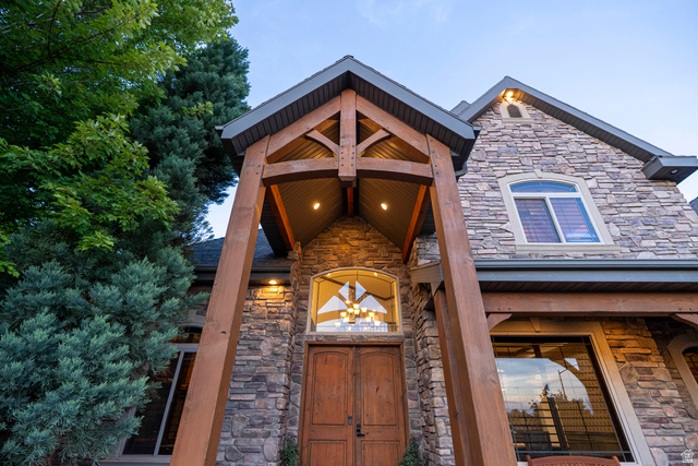 687 South 2080th Street East Springville, UT 84663 - Photo 129 of 149 Stone facade exterior featuring a prominent wood beam entry porch