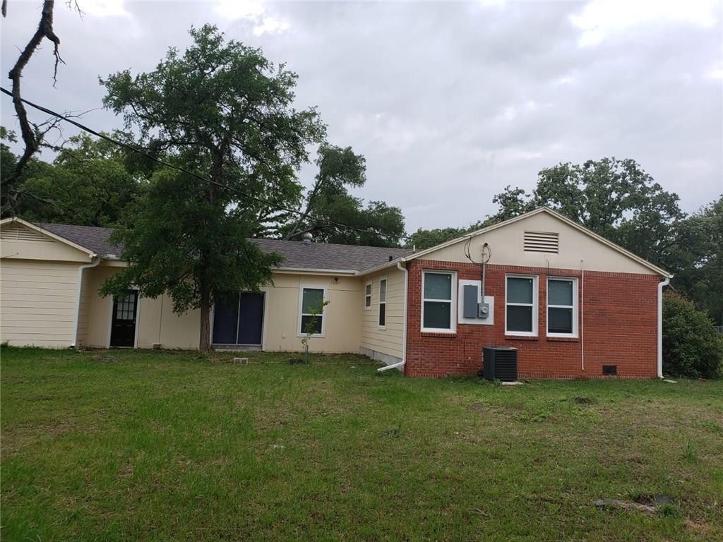 18901 Hogeye Road, Unit A Manor, TX 78653 - Photo 8 of 10 a view of a house with a yard and potted plants