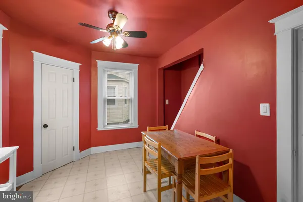 a kitchen with a refrigerator and a stove