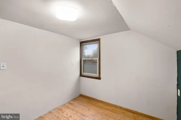a view of hallway with wooden floor