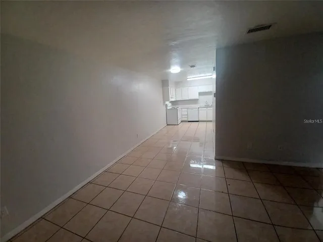 a kitchen with a sink a stove and refrigerator