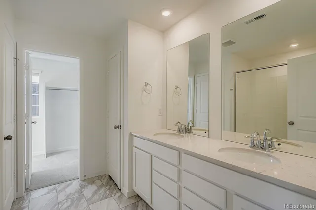 an aerial view of a house with a yard and lake view