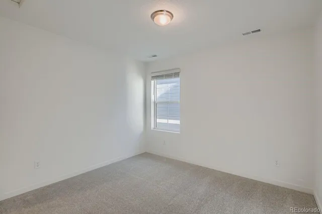 a view of a fountain in front of a house