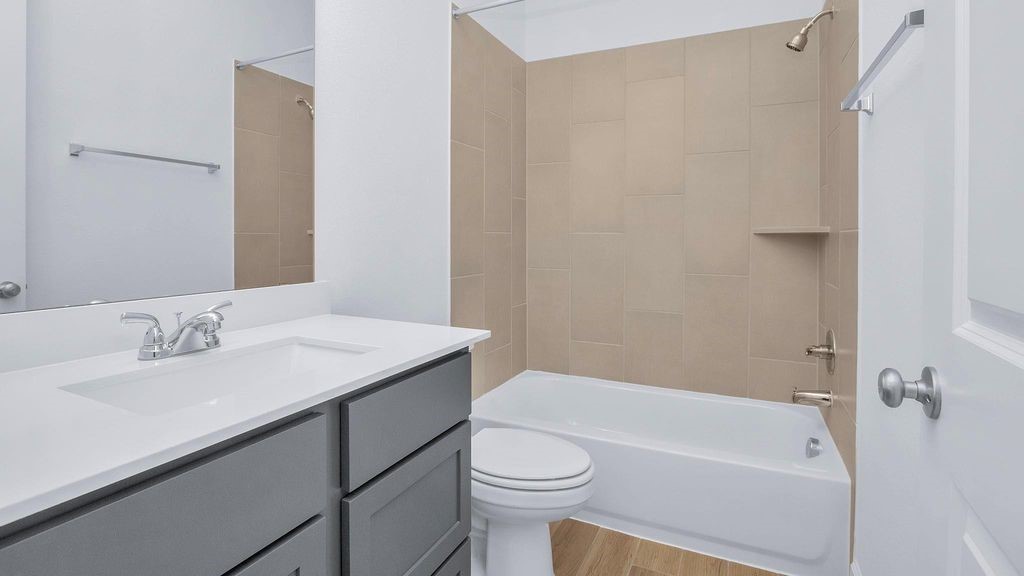 42560 Rustico Road Magnolia, TX 77354 - Photo 12 of 22 a bathroom with a sink a toilet and shower