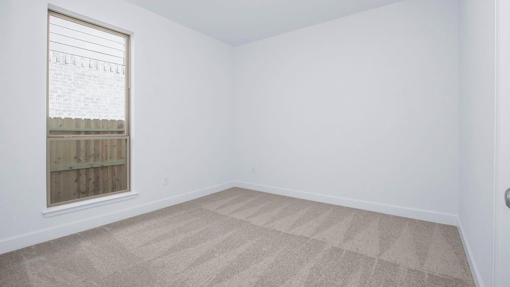 42560 Rustico Road Magnolia, TX 77354 - Photo 13 of 22 an empty room with a window