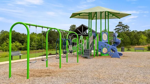a view of a swimming pool with a yard