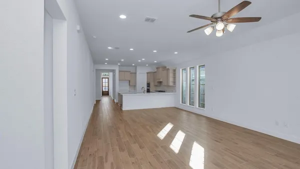 a view of a kitchen with a sink and a window