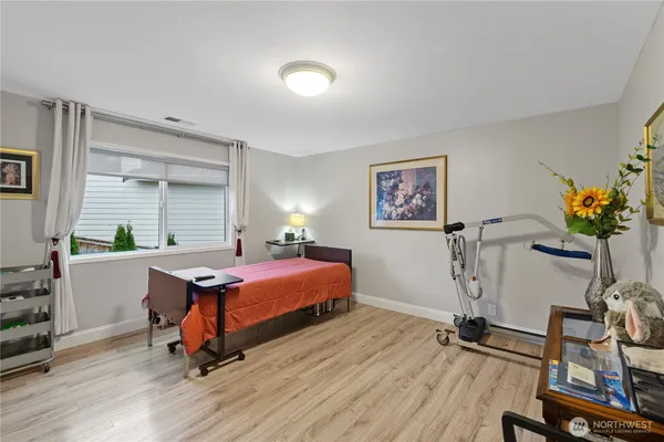 a bedroom with furniture window and a table