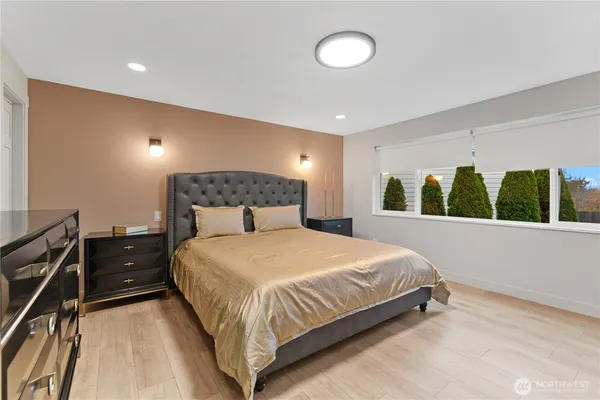 a bedroom with a bed and window
