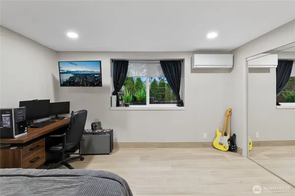 a bedroom with a bed and a window